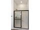 Modern shower with marble tile and frameless glass door at 5509 N 193Rd Ave, Litchfield Park, AZ 85340