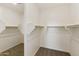 Large walk-in closet with double hanging rods at 5509 N 193Rd Ave, Litchfield Park, AZ 85340