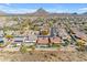 Aerial view of houses with solar panels and desert landscape at 6107 W Hedgehog Pl, Phoenix, AZ 85083