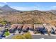 Aerial view of houses with desert landscape and mountain backdrop at 6107 W Hedgehog Pl, Phoenix, AZ 85083