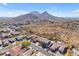 Aerial view of houses with mountain views and desert landscape at 6107 W Hedgehog Pl, Phoenix, AZ 85083