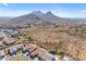 Aerial view of houses with mountain views and desert landscape at 6107 W Hedgehog Pl, Phoenix, AZ 85083