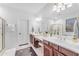 Bathroom with double vanity, soaking tub, and glass shower at 6107 W Hedgehog Pl, Phoenix, AZ 85083