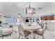 Bright dining area with a round table and chairs, open to the kitchen at 6107 W Hedgehog Pl, Phoenix, AZ 85083