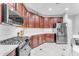 Spacious kitchen with wood cabinets and granite countertops at 6107 W Hedgehog Pl, Phoenix, AZ 85083