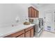 Laundry room with washer, dryer, and cabinets at 6107 W Hedgehog Pl, Phoenix, AZ 85083