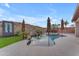 Relaxing pool area with multiple umbrellas and a waterfall feature at 6107 W Hedgehog Pl, Phoenix, AZ 85083