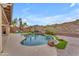 Beautiful kidney-shaped pool and spa surrounded by landscaping at 6107 W Hedgehog Pl, Phoenix, AZ 85083