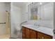 Clean bathroom, featuring a shower, toilet and vanity with marble top at 6457 E Dallas St, Mesa, AZ 85205