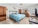 Spacious bedroom with a king-size bed and wood furniture at 6457 E Dallas St, Mesa, AZ 85205