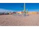 Dreamland Villa community entrance sign with a large cactus at 6457 E Dallas St, Mesa, AZ 85205