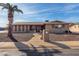 Brick ranch house with a landscaped front yard and walkway at 6457 E Dallas St, Mesa, AZ 85205