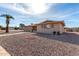 Brick ranch style home with a palm tree and walkway at 6457 E Dallas St, Mesa, AZ 85205