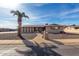 Single story home with a palm tree and walkway at 6457 E Dallas St, Mesa, AZ 85205