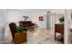 Living room with brown recliner, wooden end tables, and tiled floors at 6457 E Dallas St, Mesa, AZ 85205