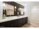 Spa-like bathroom with double vanity and a marble-tiled shower at 6547 E Eugie Ter, Scottsdale, AZ 85254