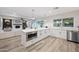 Modern kitchen with white shaker cabinets, quartz countertops, and stainless steel appliances at 6547 E Eugie Ter, Scottsdale, AZ 85254