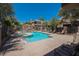 Inviting community pool area featuring comfortable lounge chairs and well-maintained landscaping at 7400 E Gainey Club Dr # 222, Scottsdale, AZ 85258