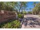 Elegant stone entrance sign at Gainey Club Drive, surrounded by colorful flowers and lush greenery at 7400 E Gainey Club Dr # 222, Scottsdale, AZ 85258