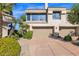 Contemporary two-story home boasting a two-car garage and well-manicured landscaping at 7400 E Gainey Club Dr # 222, Scottsdale, AZ 85258