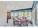 Sunlit dining area with a table, chairs, and view to backyard at 745 Leisure World --, Mesa, AZ 85206