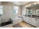 Modern bathroom with subway tile and a soaking tub at 7460 E Via De Luna Dr, Scottsdale, AZ 85255