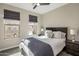 Spacious bedroom with a queen bed, dark wood furniture and neutral decor at 7460 E Via De Luna Dr, Scottsdale, AZ 85255