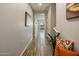 Light-filled hallway with wood-look tile floors at 7460 E Via De Luna Dr, Scottsdale, AZ 85255