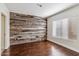 Bedroom features wood-look flooring and an accent wall at 750 E Northern Ave # 1089, Phoenix, AZ 85020