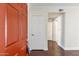 Apartment entryway with orange door and hardwood floors at 750 E Northern Ave # 1089, Phoenix, AZ 85020