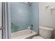 Updated bathroom with light blue tile and shower/tub combo at 8100 E Camelback Rd # 14, Scottsdale, AZ 85251