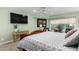 Comfortable bedroom with a large bed and flat-screen TV at 8100 E Camelback Rd # 14, Scottsdale, AZ 85251