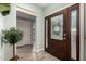 Interior entryway with a wood door and tile floor at 8100 E Camelback Rd # 14, Scottsdale, AZ 85251