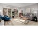 Living room with french doors leading to patio at 8100 E Camelback Rd # 14, Scottsdale, AZ 85251