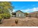 Landscaped backyard with flagstone pathway and desert plants at 8533 E Monte Ave, Mesa, AZ 85209