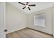 Bright bedroom with wood-look floors and ceiling fan at 8533 E Monte Ave, Mesa, AZ 85209