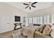 Bright bedroom with hardwood floors, ceiling fan and en-suite bathroom at 8533 E Monte Ave, Mesa, AZ 85209