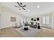 Spacious living room with light gray sofa and two armchairs at 8533 E Monte Ave, Mesa, AZ 85209