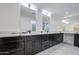 Modern bathroom with double vanity and marble counters at 8641 E Fillmore St, Scottsdale, AZ 85257