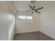 Well-lit bedroom featuring a window and sliding door closet at 8641 E Fillmore St, Scottsdale, AZ 85257