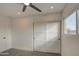 Modern bedroom with sliding door closet and window at 8641 E Fillmore St, Scottsdale, AZ 85257