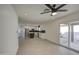 Open dining area with access to the backyard and views of kitchen at 8641 E Fillmore St, Scottsdale, AZ 85257