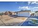 House exterior with a spacious driveway and two-car garage at 8641 E Fillmore St, Scottsdale, AZ 85257