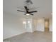 Bright and airy living room with tile floors and ceiling fan at 8641 E Fillmore St, Scottsdale, AZ 85257