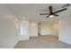 Spacious living room with tile flooring and a ceiling fan at 8641 E Fillmore St, Scottsdale, AZ 85257