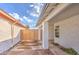 Side yard with wooden gate and a covered walkway at 8641 E Fillmore St, Scottsdale, AZ 85257