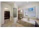 Spa-like bathroom featuring a soaking tub and walk-in shower at 8793 W Villa Lindo Dr, Peoria, AZ 85383