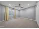 Bright bedroom with yellow chevron curtains and carpet flooring at 8793 W Villa Lindo Dr, Peoria, AZ 85383