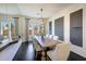 Spacious dining area with a wooden table and modern chandelier at 8793 W Villa Lindo Dr, Peoria, AZ 85383