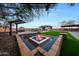 Enjoy the firepit with seating under the pergola at 8793 W Villa Lindo Dr, Peoria, AZ 85383